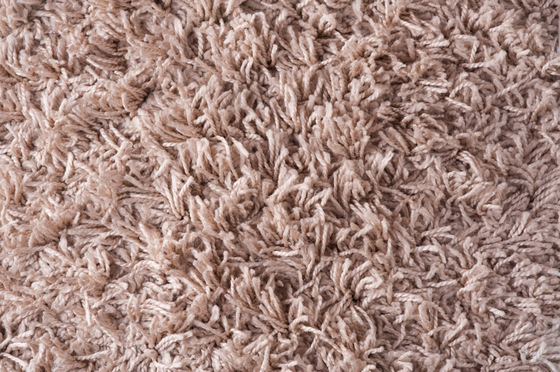 Texture,Of,A,Brown,Carpet,With,Long,Pile,rug Close-up of a shag rug